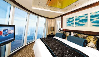 1548636687.8456_c351_Norwegian Cruise Line Norwegian Epic Accommodation Deluxe Owners Suite Bedroom.jpg
